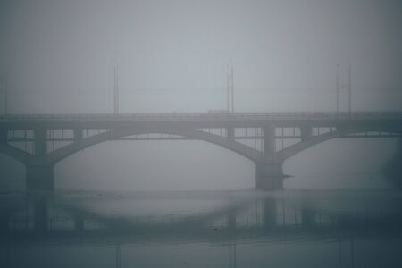 Bridge with fog in mist in the cityの写真素材