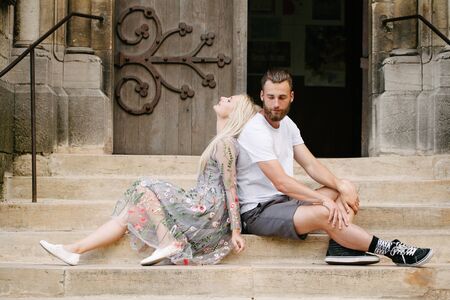 Couple in love hugging and relaxing in Paris/ They are wearing trendy clothes. Man is a hipster with a beard wearing white t-shirtの写真素材