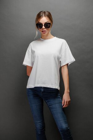 Sexy woman or girl wearing white blank t-shirt with spaceの写真素材