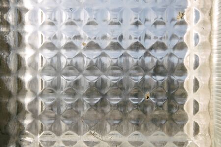 Old glass texture background with light going throughの写真素材