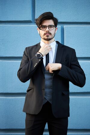 Portrait of a young businessman in a suit outdoorの写真素材