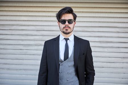 Portrait of a young businessman in a suit outdoorの写真素材
