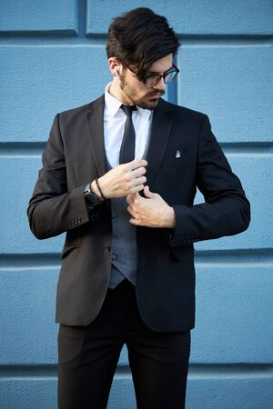 Portrait of a young businessman in a suit outdoorの写真素材