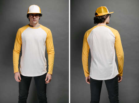 Man model with beard wearing white and yellow blank Long Sleeve Shirt for mock up and a baseball cap with space for your  design over gray backgroundの写真素材