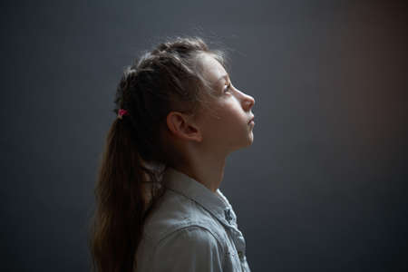 Kid girl child portrait looking upの写真素材