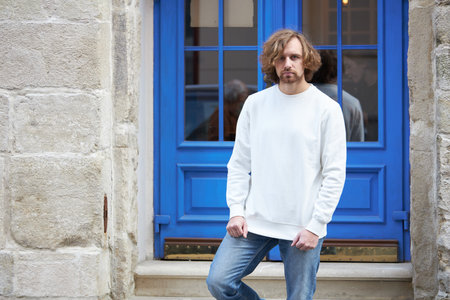 Man wearing blank white sweatshirt. Sweatshirt or hoodie for mock up, logo designs or design print with with free space.の写真素材