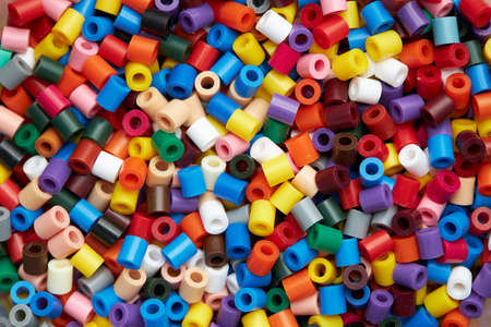 Colorful background made of plastic beadsの写真素材