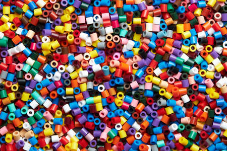 Colorful background made of plastic beadsの写真素材