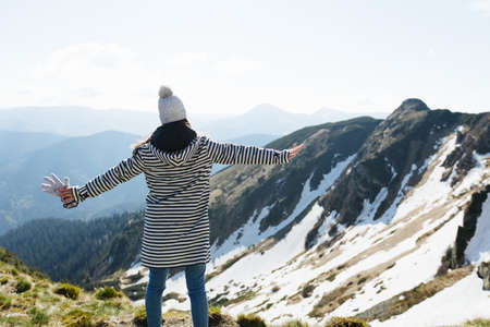 Woman hiker enjoying high peak view on mountains in summer. Pip Ivan peak. Marmarosy ridge, Carpathian, Ukraineの写真素材