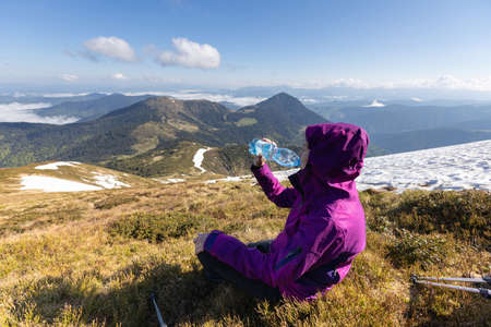 Woman hiker enjoying high peak view on mountains in summer. Pip Ivan peak. Marmarosy ridge, Carpathian, Ukraineの写真素材