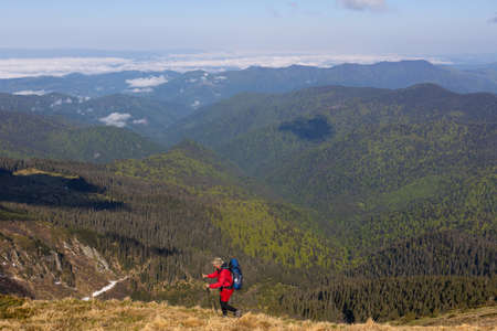 Hiker trekking to the highest ukrainian ridge Marmarosy near Romania. Mountain named Pip Ivanの写真素材