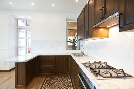 Modern wooden kitchen in scandinavian interior with cooking appliances. Real imageの写真素材