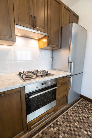 Modern kitchen oven in scandinavian interior with cooking appliances. Real imageの写真素材
