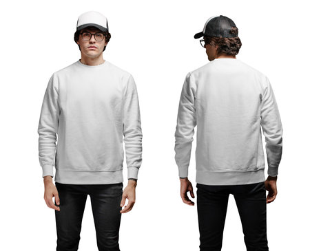 Man wearing blank white sweatshirt and empty baseball cap standing isolated on white background.の写真素材