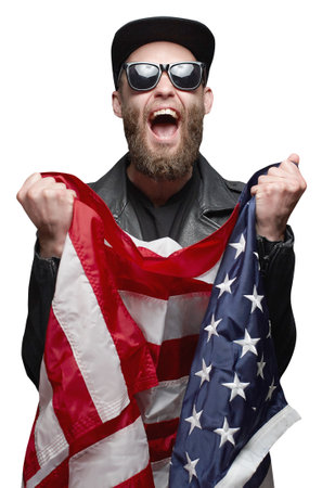 Patriot hipster man holding emotionally american usa flag isolated on white backgroundの写真素材