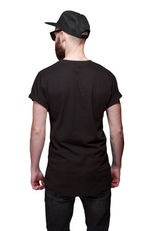 Hipster handsome male model with beard wearing black blank t-shirt isolated on white backgroundの写真素材