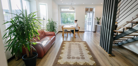 Woman working in modern private home interiorの写真素材