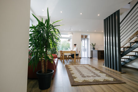 Woman working in modern private home interiorの写真素材