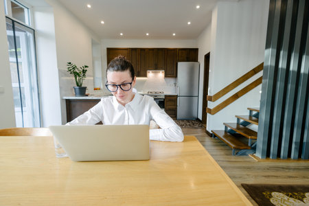 Woman working in modern private home interiorの写真素材