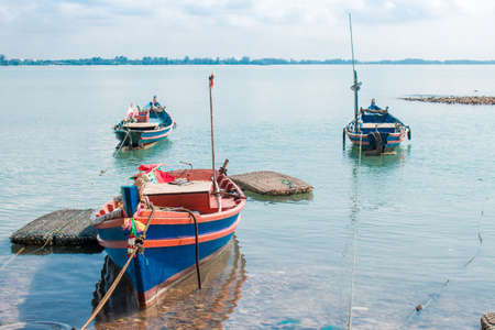 Fishing boats floating on sea in summer.の写真素材