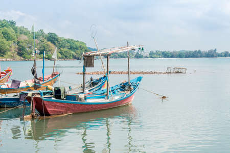 Fishing boats floating on sea in summer.の写真素材