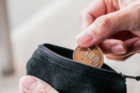 Close up coin with small money pouchの写真素材