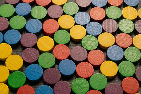 multicolored, wooden, playing piece arranged in rowsの写真素材