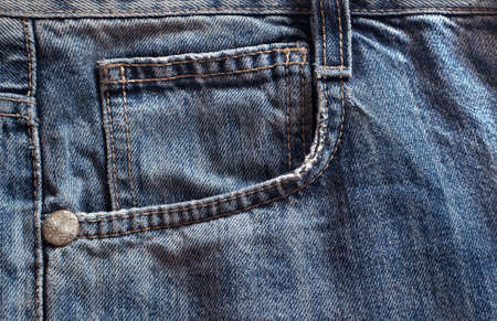 side pocket of old on jeans close-upの写真素材