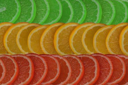 background of sliced citrus red, yellow and green