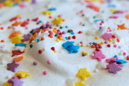 confectionary glaze, top with confectionery decoration. Easter cake decorated with asterisks and balls.の写真素材