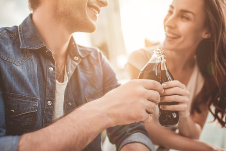 Beautiful romantic couple is having rest in the city. Enjoying the company of each other.の写真素材