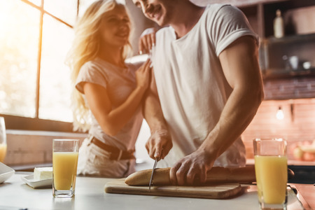 Attractive couple on kitchen is cooking.の写真素材