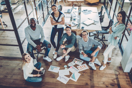 Multiracial young creative people in modern office.の写真素材