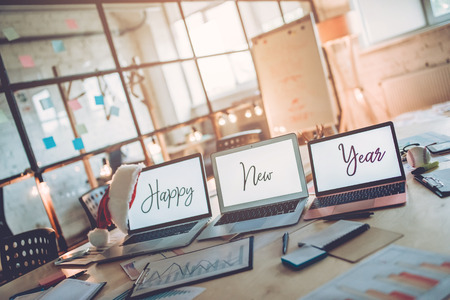 Merry Christmas and Happy New Year 2018! Celebrating holiday in modern office. Last working day.
