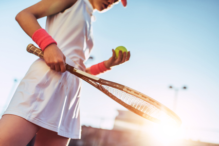 Sport young woman on tennis court. Female tennis player.の写真素材