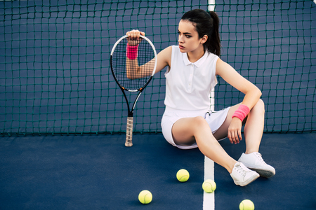 Sport young woman on tennis court. Female tennis player.の写真素材