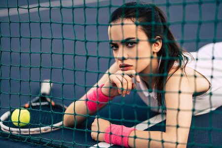 Sport young woman on tennis court. Female tennis player.の写真素材