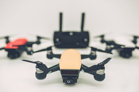 Light white store with modern devices. Quadcopters, glasses of virtual reality, camera with stabilization system, 4K video.の写真素材