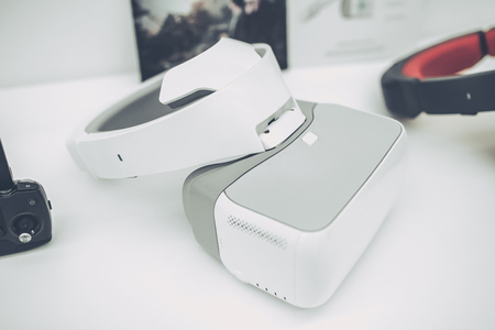 Light white store with modern devices. Quadcopters, glasses of virtual reality, camera with stabilization system, 4K video.の写真素材