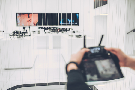 Cute little boy in modern light quadcopter store.の写真素材
