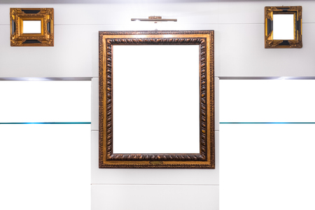 Antique wooden frames mock on wall white, with shelvesの写真素材