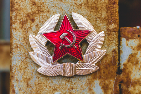 Communist Soviet Badge on a rustic columnの写真素材