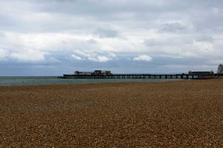 Pebble beach towards the wreck of Hastings Pier after the fireの写真素材