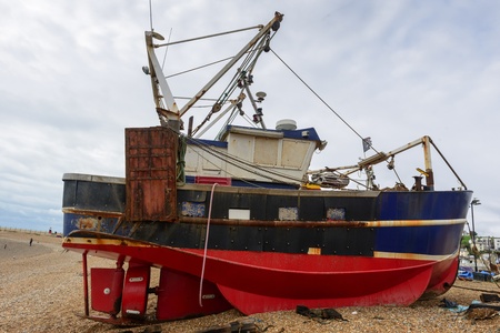 Red and blue fishing boatの写真素材