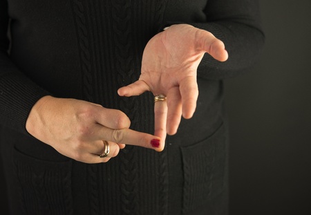 Woman Demonstrating Sign Language letter Oの写真素材