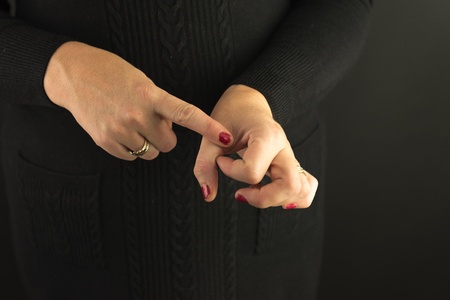Woman Demonstrating Sign Language letter Qの写真素材