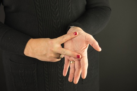 Woman Demonstrating Sign Language letter Vの写真素材