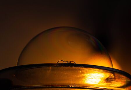 Sunrise / sunset inside a water bubble/ soap bubbleの写真素材