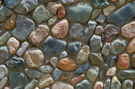 Wall made from colorful stonesの写真素材