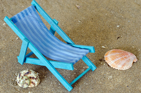 Beach chair under palm treeの写真素材